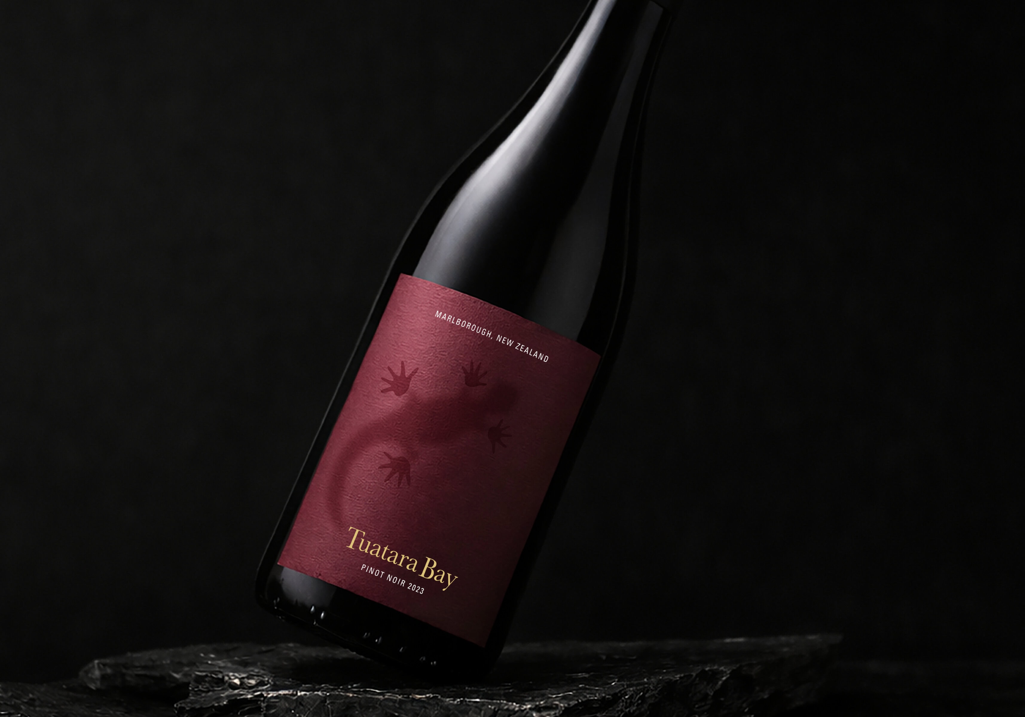 Tuatara Bay_TCM Web2 The Marlborough Pinot Noir expression uses a deep, earthy red to bring warmth, richness and quiet drama from the vines to shelf.