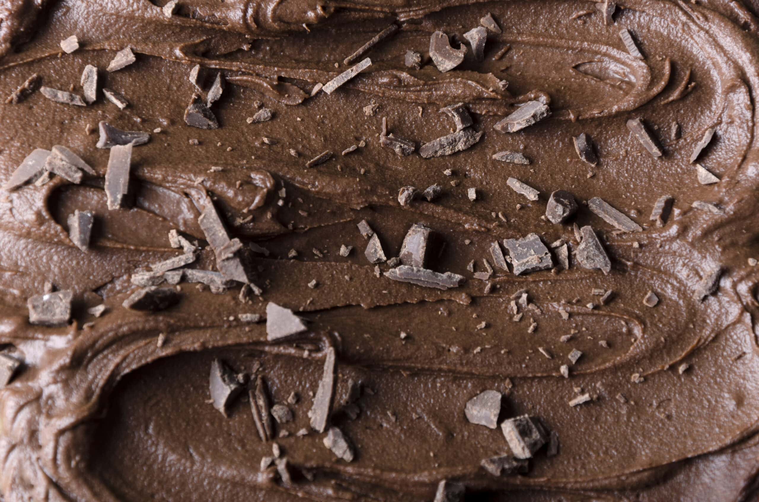 Closeup of melted chocolate and chocolate chips on top of it